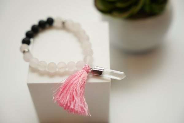 Rose Quartz Bracelet finished with Lava Beads on a white carton box